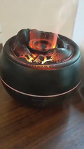 Diffuseur Lueur noir craquelé allumé sur un meuble
